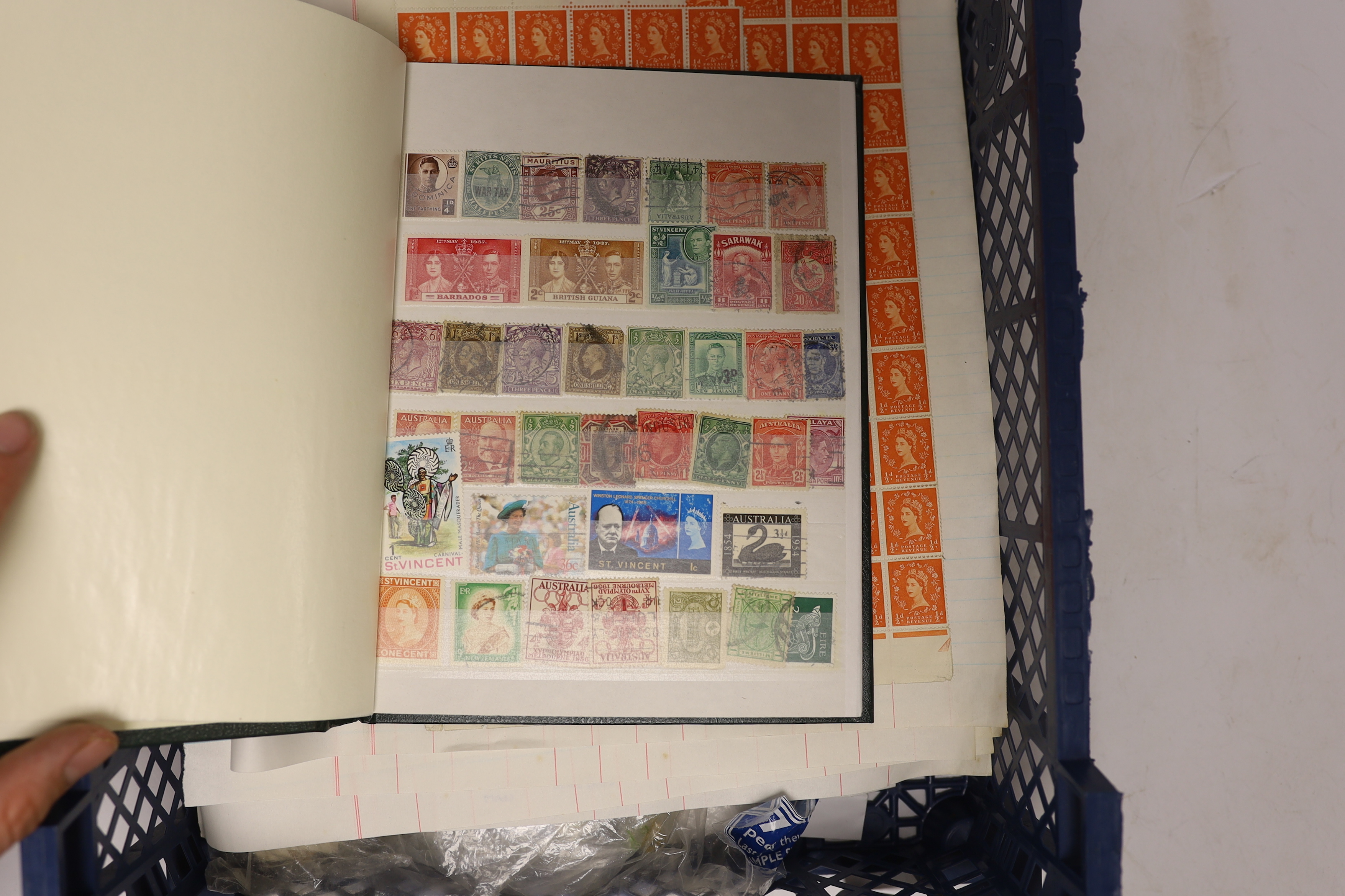 Two stamp albums and various loose pages and bags of loose stamps